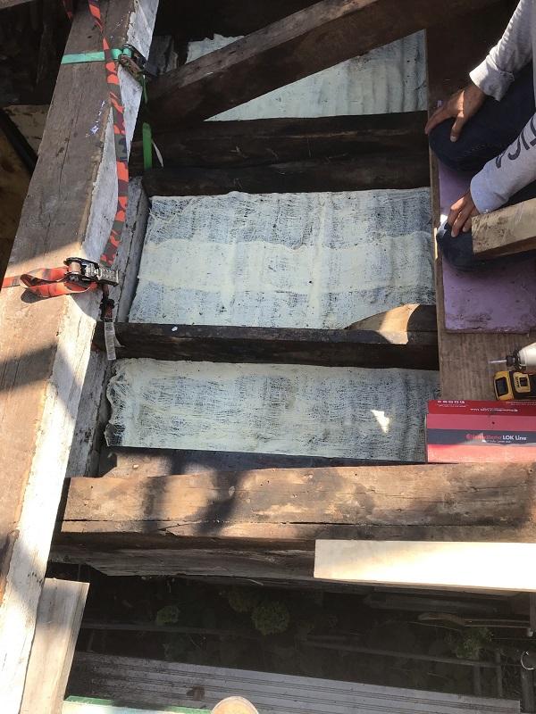 The back side of reinforced historic ceiling plaster