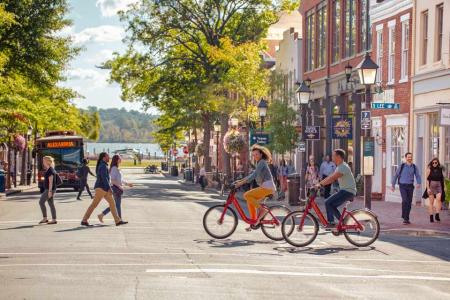 Photo of biking, walking, bus on King Street, courtesy of Visit Alexandria